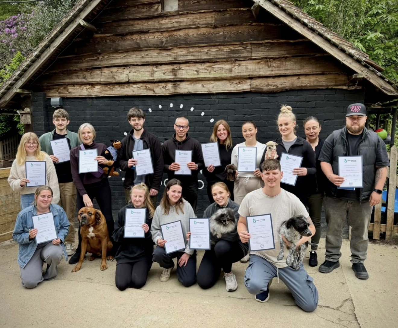 The Duncan's Dog Co team holding their certificates